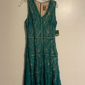 Green and tan dress size “8”.